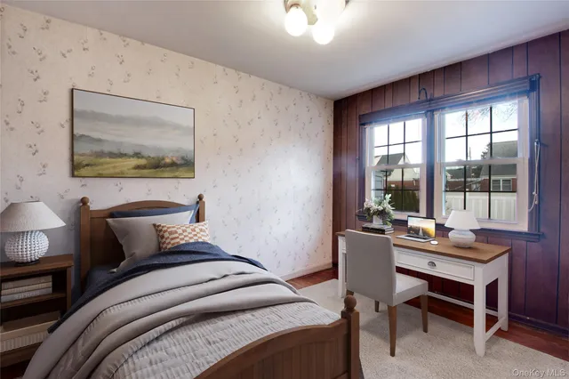 a bedroom with furniture and a window