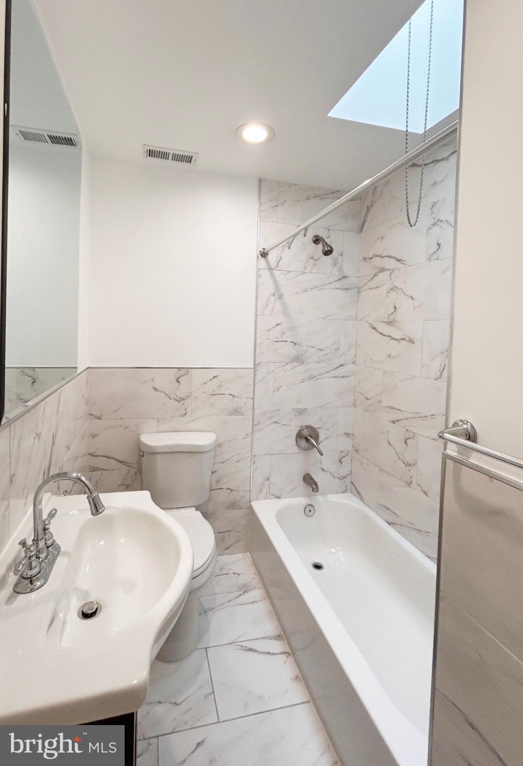 1241 Orthodox Street Philadelphia, PA 19124 - Photo 19 of 26 a bathroom with a sink and mirror