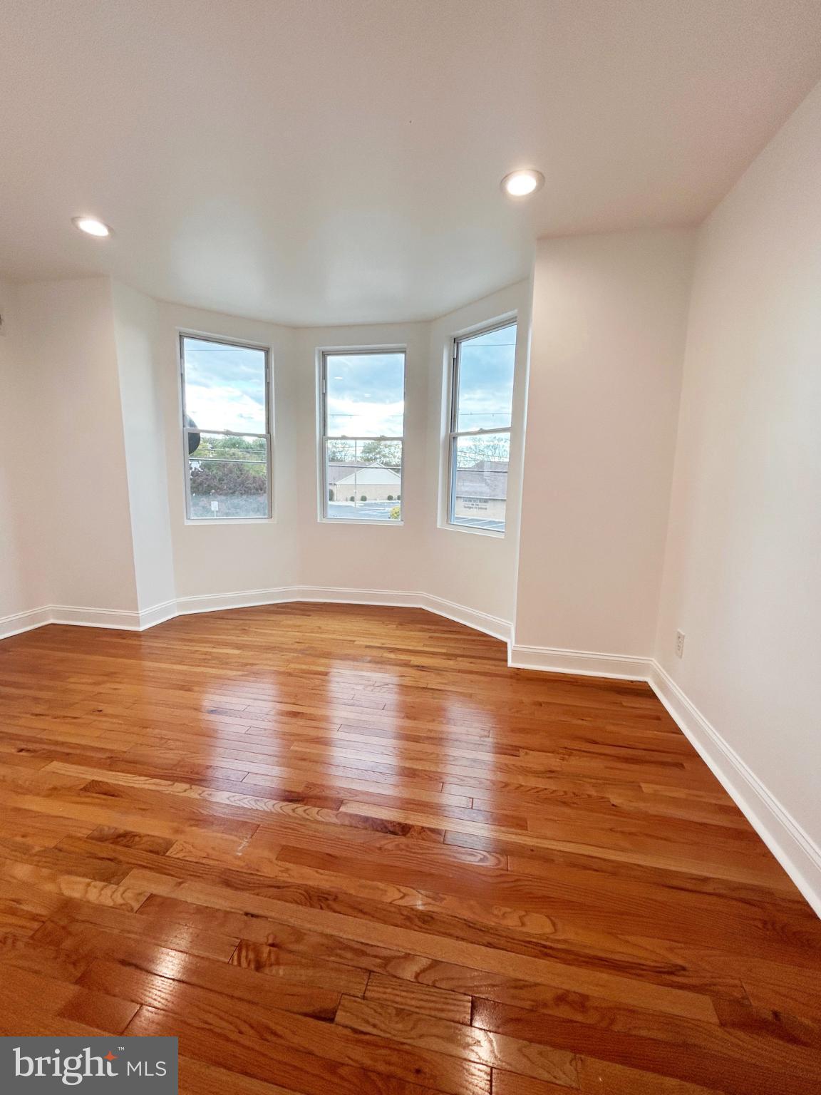1241 Orthodox Street Philadelphia, PA 19124 - Photo 20 of 26 a view of empty room with wooden floor and fan