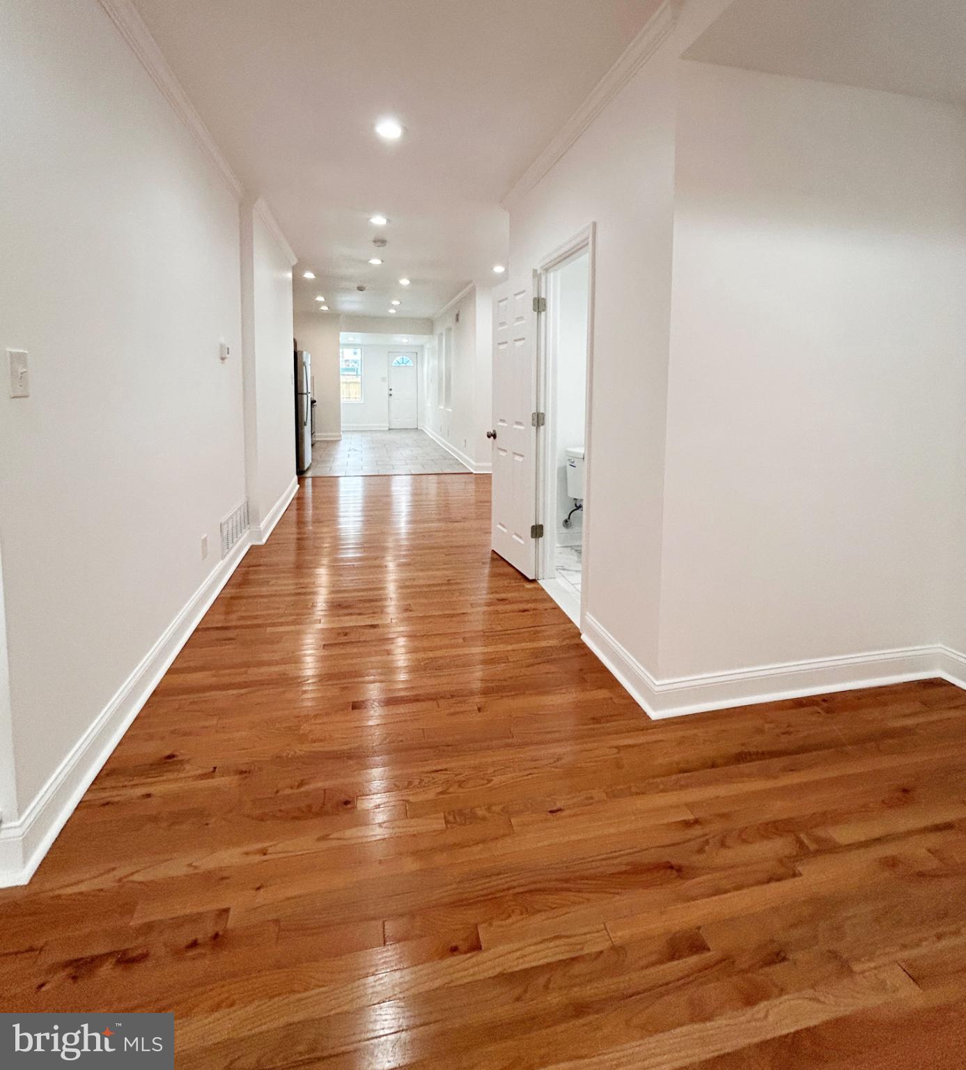 1241 Orthodox Street Philadelphia, PA 19124 - Photo 3 of 26 a view of an empty room with wooden floor