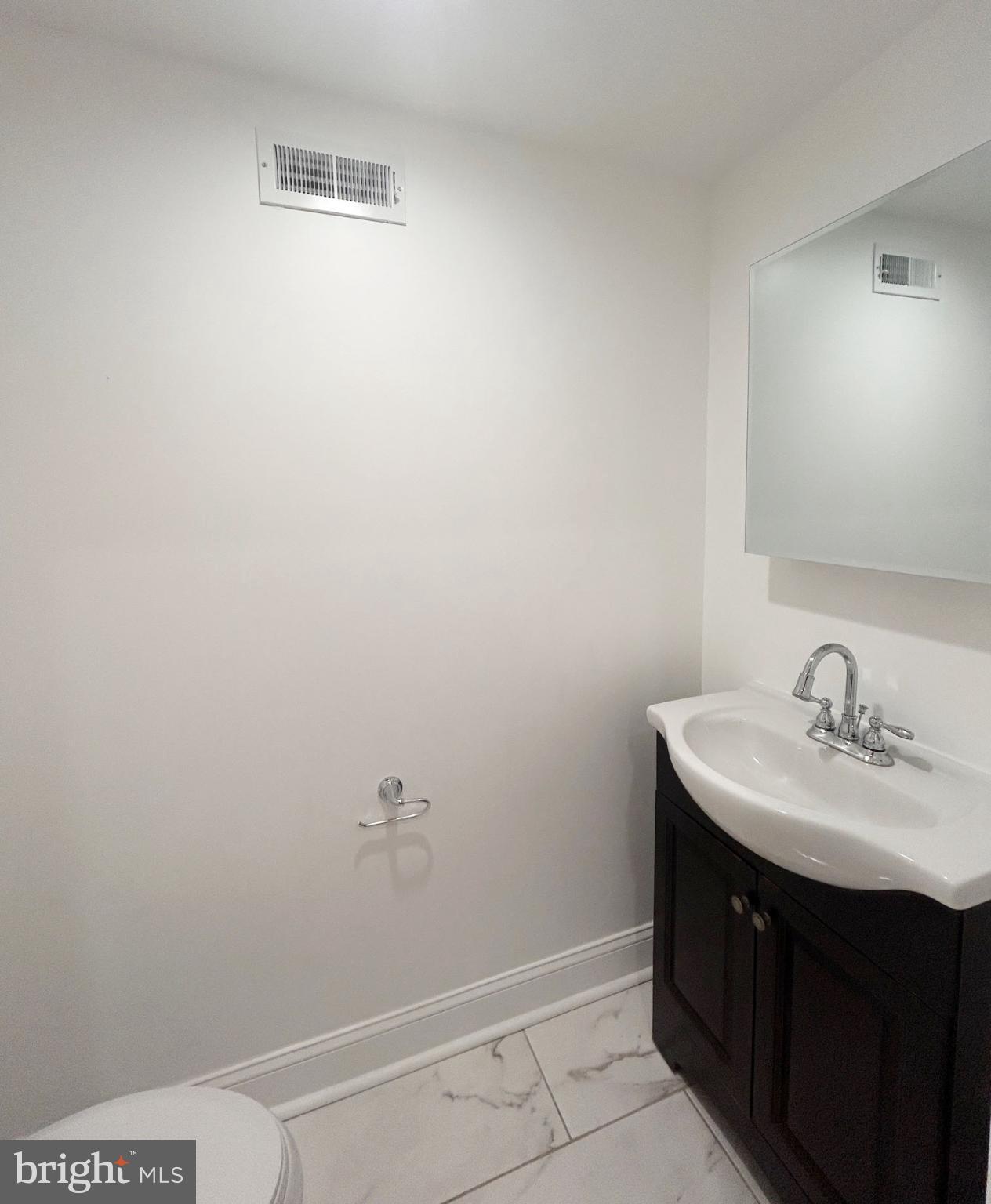 1241 Orthodox Street Philadelphia, PA 19124 - Photo 5 of 26 a bathroom with a sink and a mirror