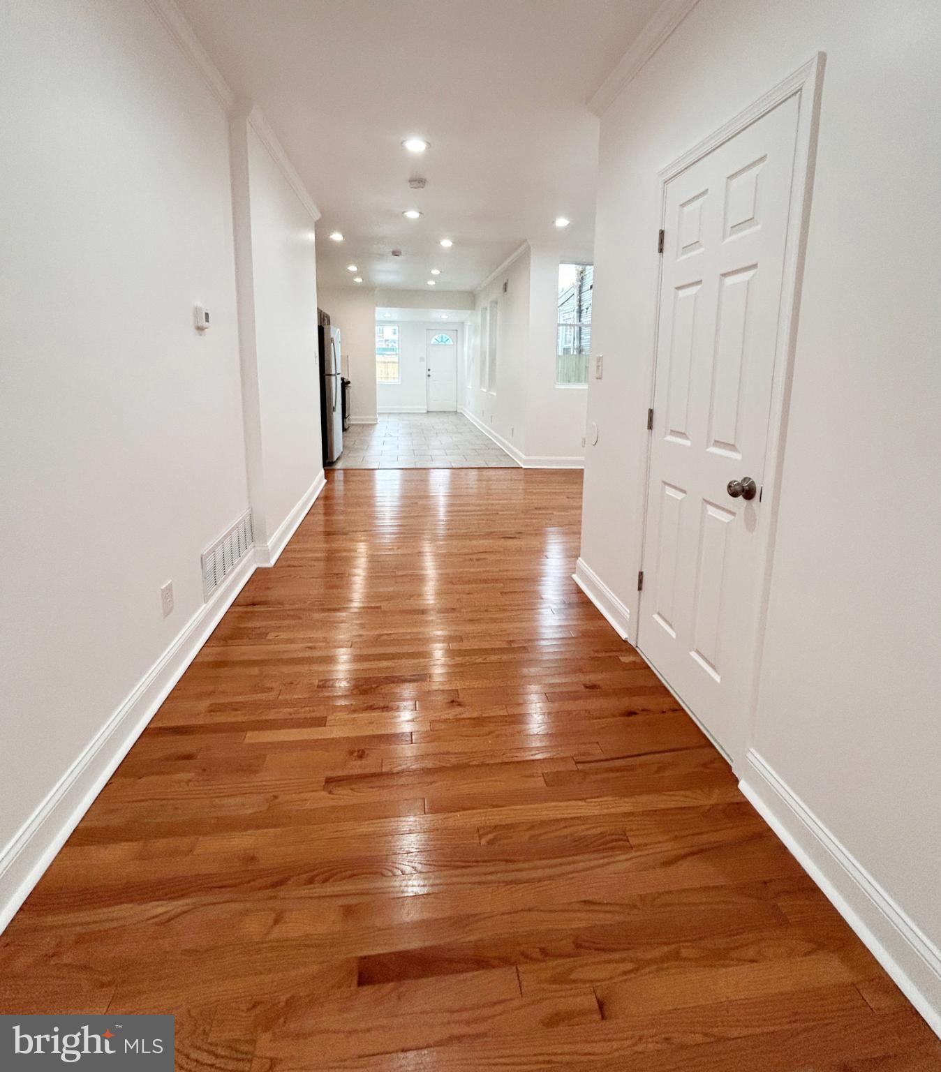 1241 Orthodox Street Philadelphia, PA 19124 - Photo 6 of 26 a view of a hallway with wooden floor