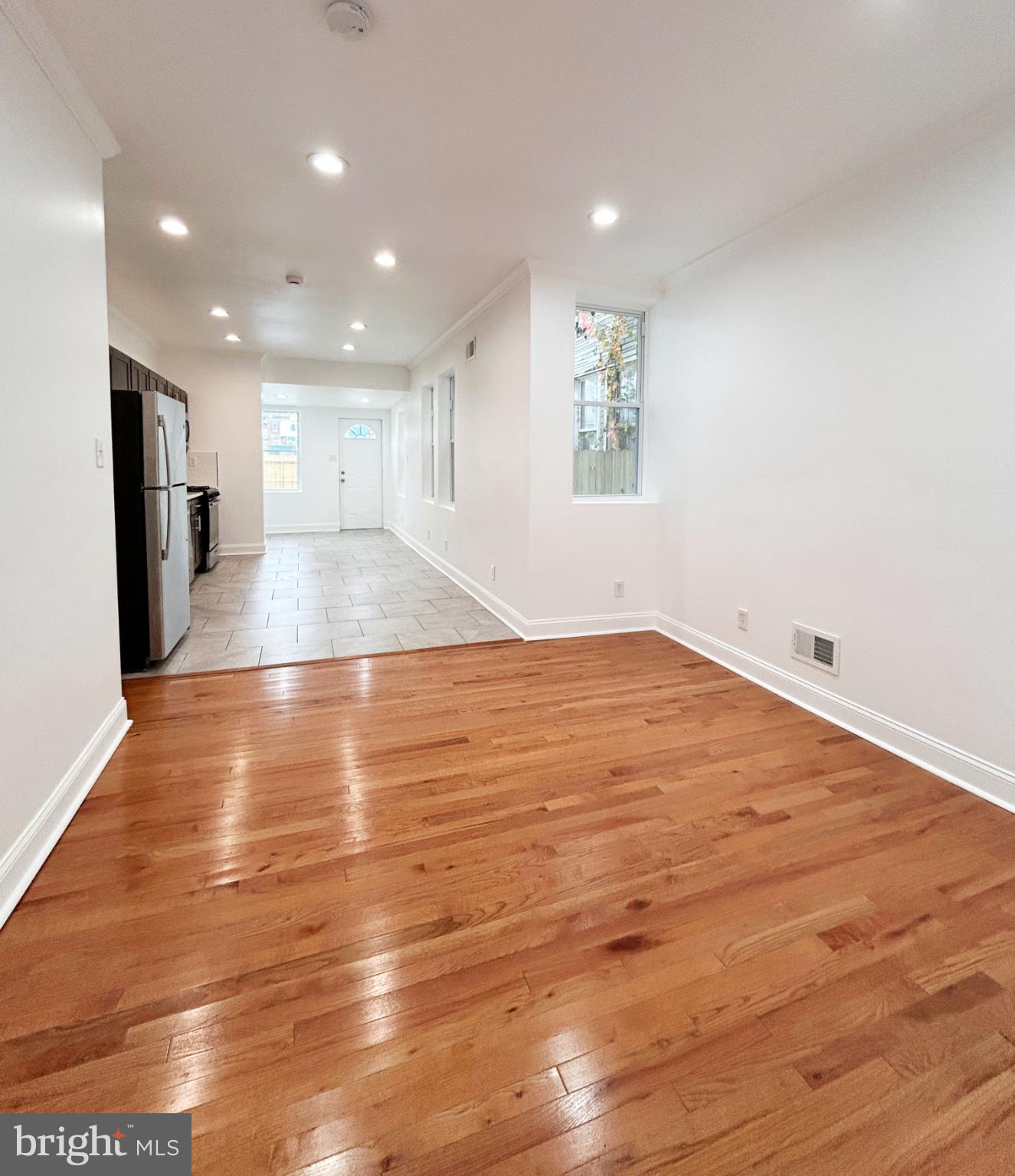 1241 Orthodox Street Philadelphia, PA 19124 - Photo 7 of 26 a view of empty room with wooden floor
