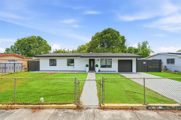 a view of a house with a yard