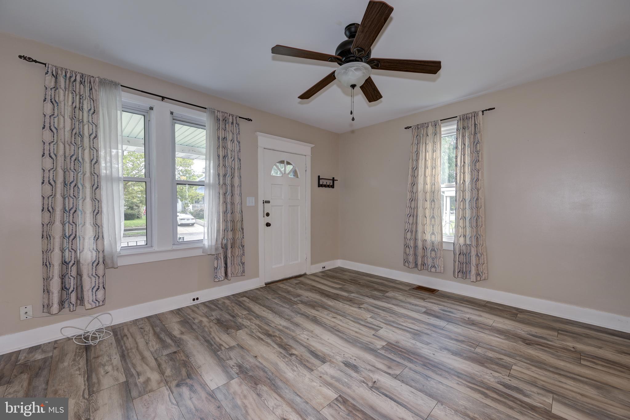 323 Cleveland Avenue Riverside, NJ 08075 - Photo 11 of 36 a view of empty room with wooden floor and fan