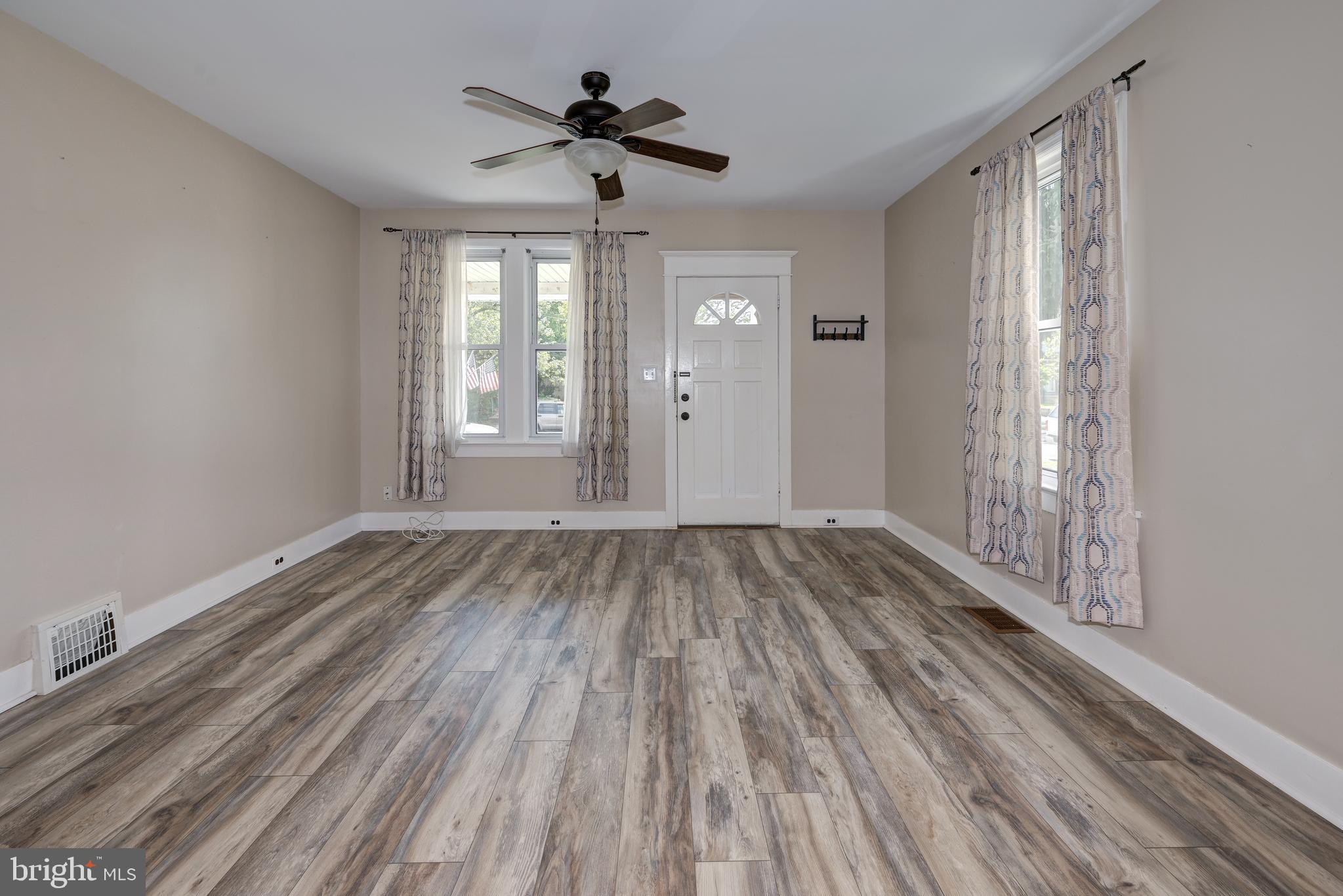 323 Cleveland Avenue Riverside, NJ 08075 - Photo 12 of 36 a view of empty room with wooden floor and fan