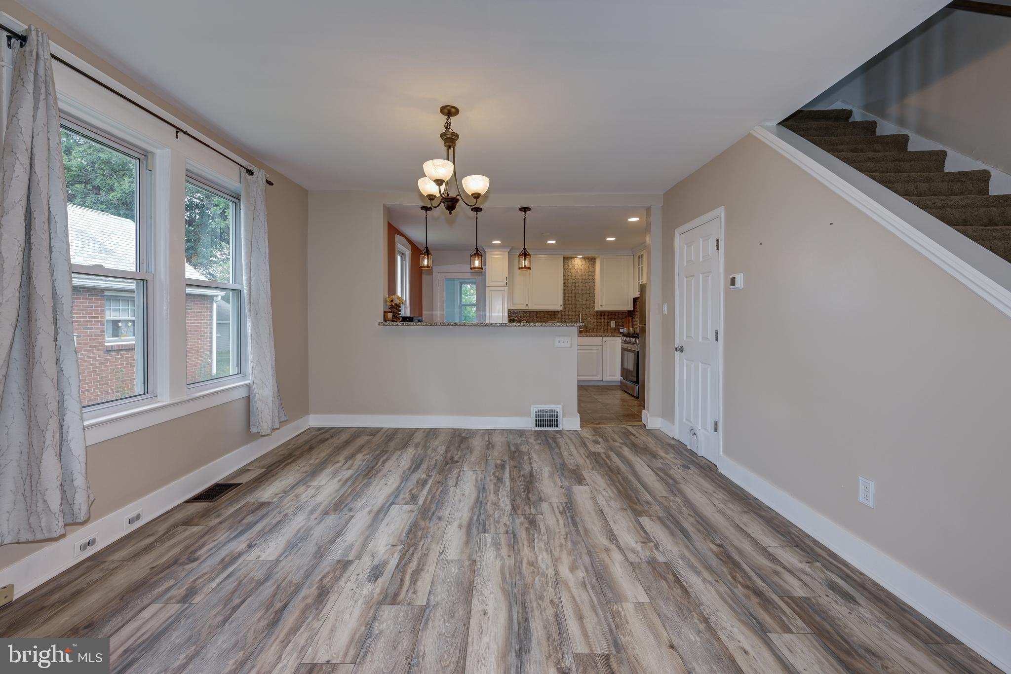 323 Cleveland Avenue Riverside, NJ 08075 - Photo 13 of 36 wooden floor in an empty room with a window