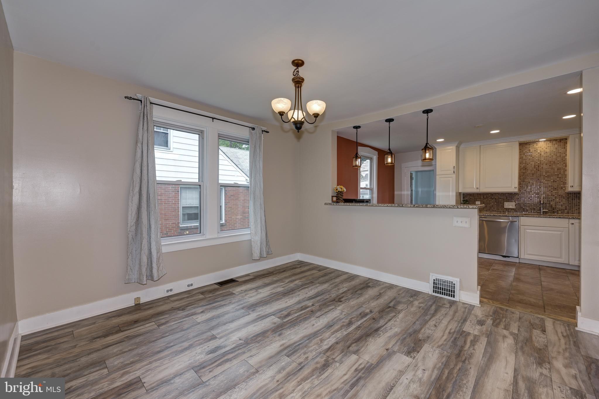 323 Cleveland Avenue Riverside, NJ 08075 - Photo 14 of 36 wooden floor in an empty room with a window