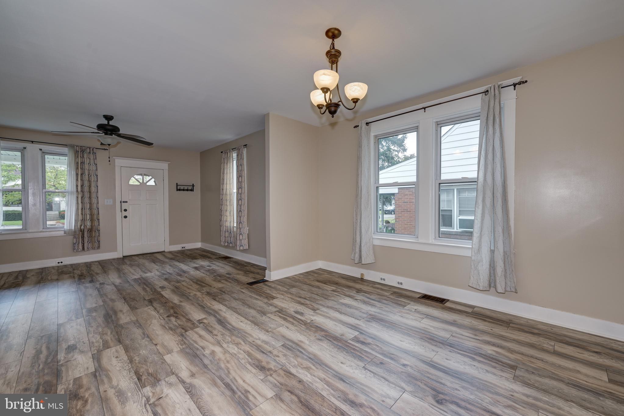 323 Cleveland Avenue Riverside, NJ 08075 - Photo 15 of 36 a view of an empty room with wooden floor and a window