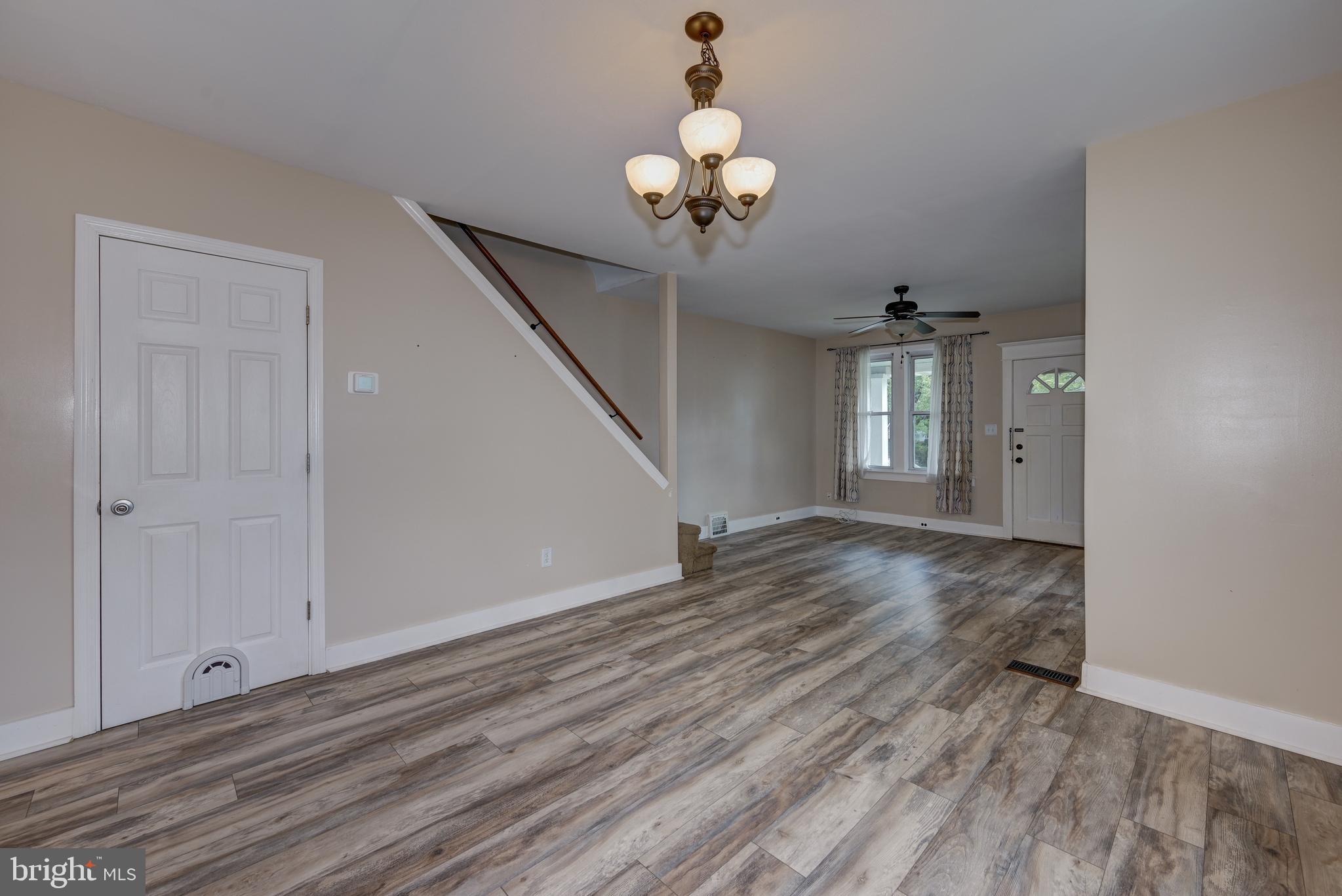323 Cleveland Avenue Riverside, NJ 08075 - Photo 16 of 36 a view of a room with wooden floor and chandelier
