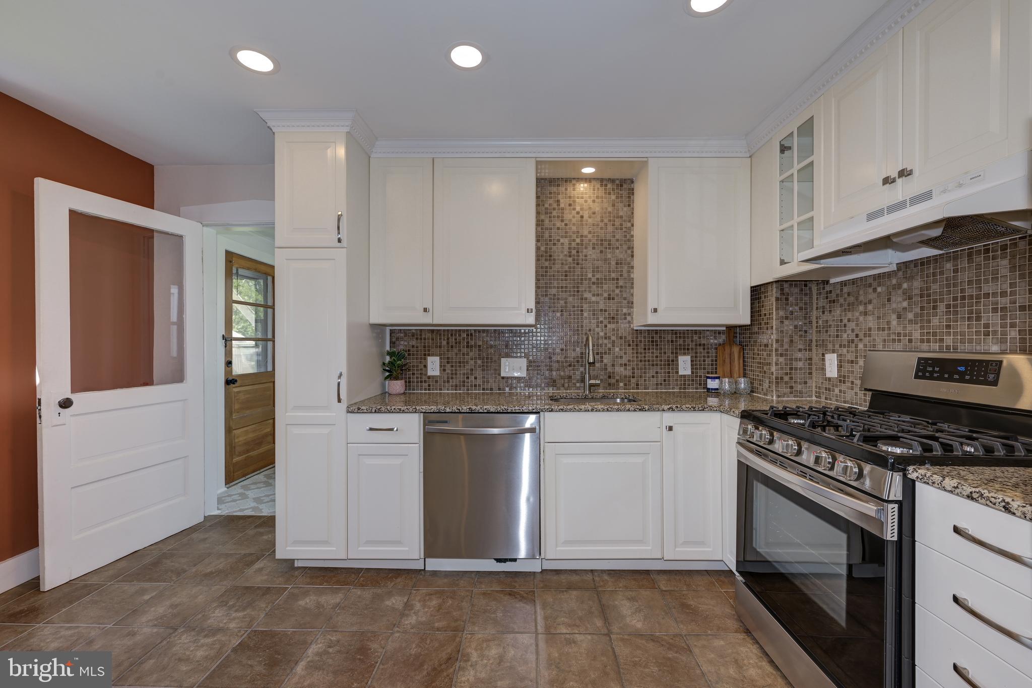 323 Cleveland Avenue Riverside, NJ 08075 - Photo 20 of 36 a kitchen with stainless steel appliances granite countertop a stove and a sink