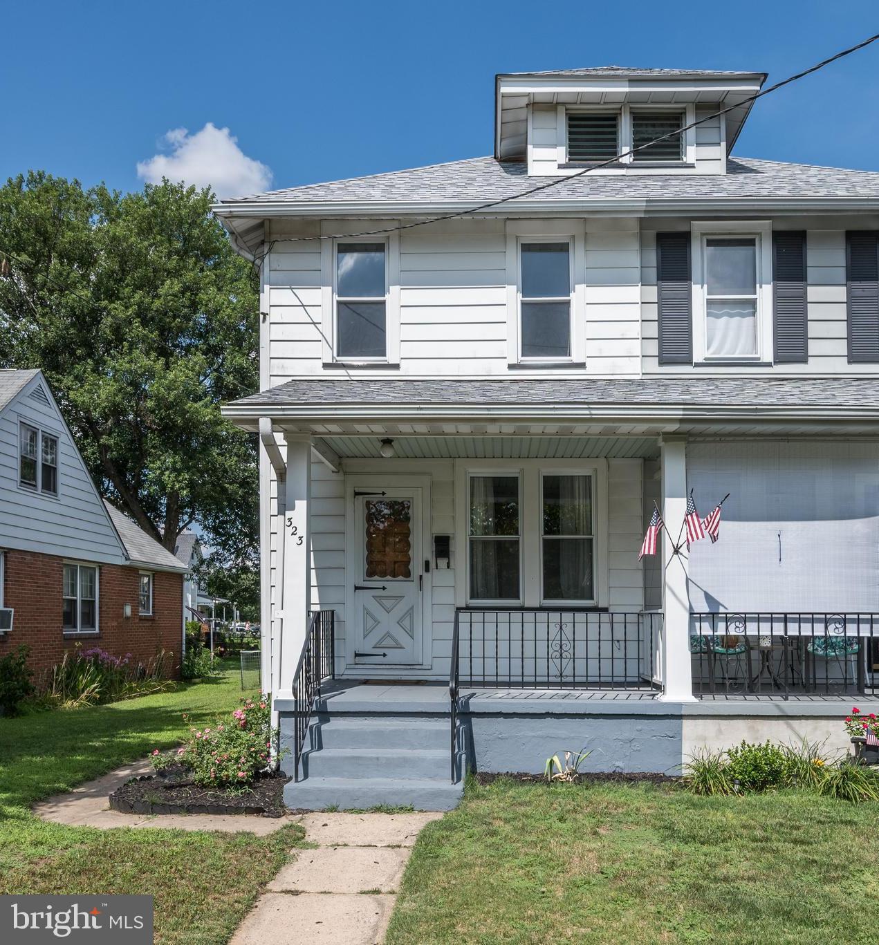 323 Cleveland Avenue Riverside, NJ 08075 - Photo 2 of 36 a front view of a house with a yard