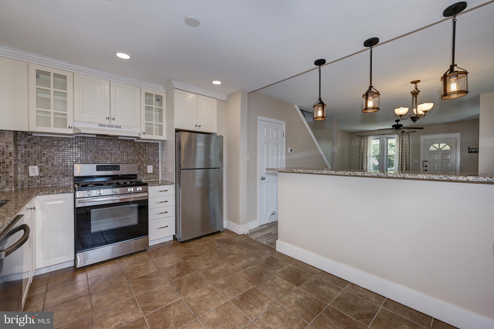 323 Cleveland Avenue Riverside, NJ 08075 - Photo 23 of 36 a kitchen with refrigerator and cabinets