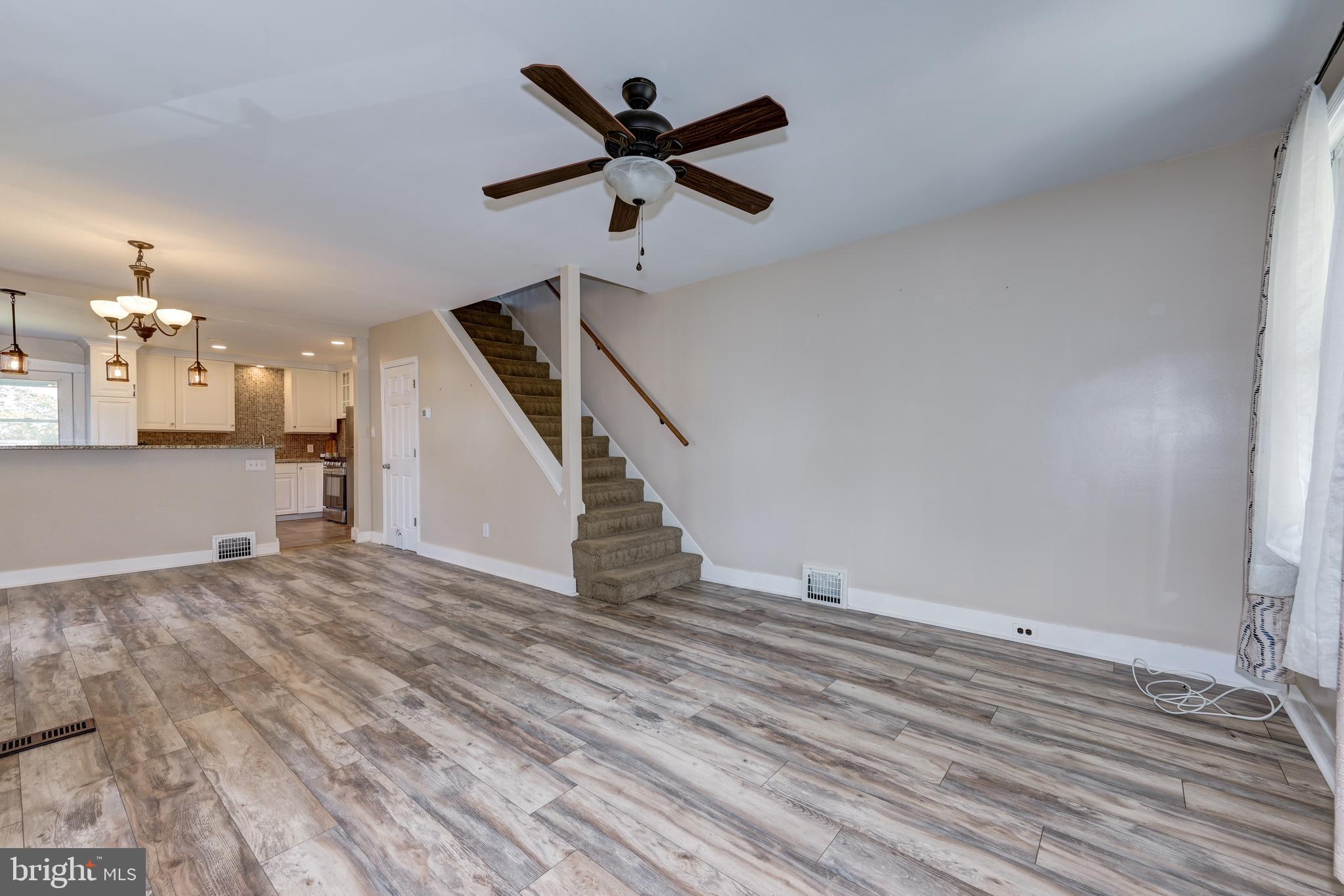 323 Cleveland Avenue Riverside, NJ 08075 - Photo 8 of 36 wooden floor in an empty room with a window