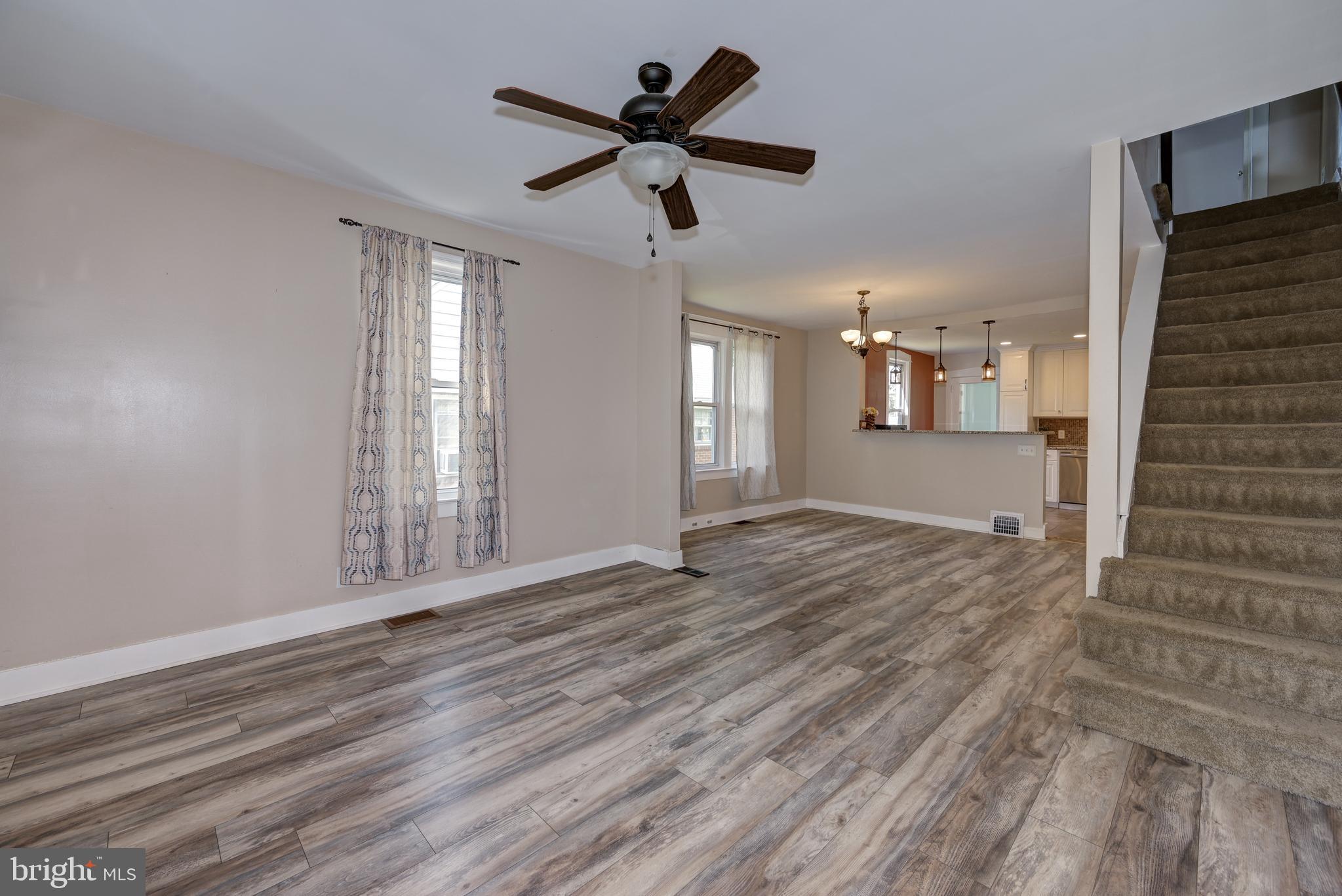 323 Cleveland Avenue Riverside, NJ 08075 - Photo 9 of 36 a view of an empty room with wooden floor and a window