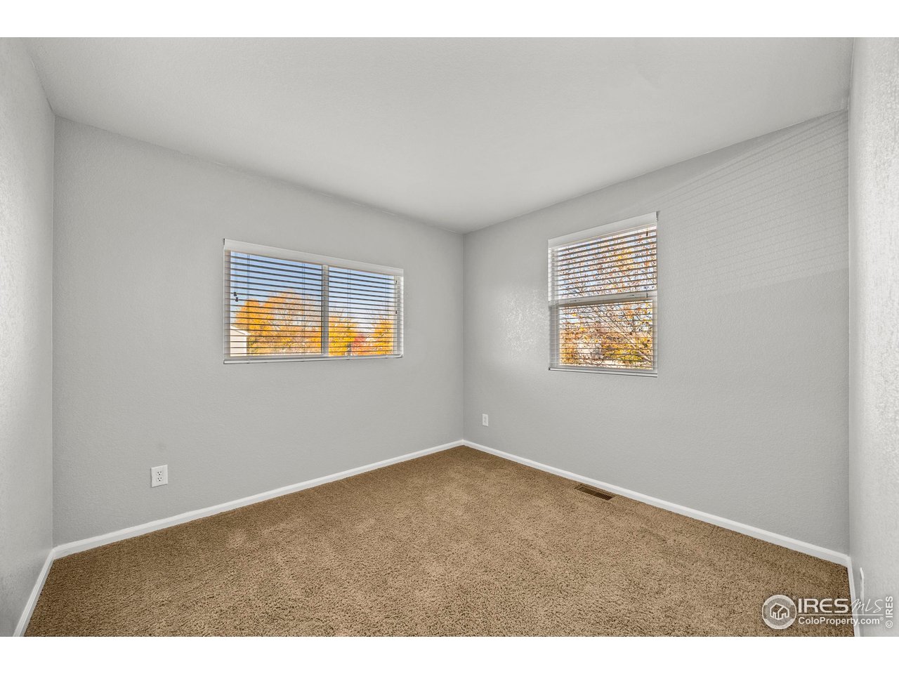 10688 Durango Place Longmont, CO 80504 - Photo 22 of 49 an empty room with windows
