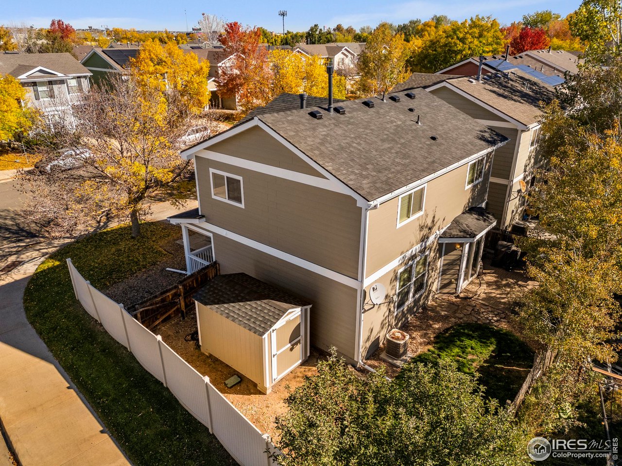 10688 Durango Place Longmont, CO 80504 - Photo 28 of 49 a view of a house with wooden fence