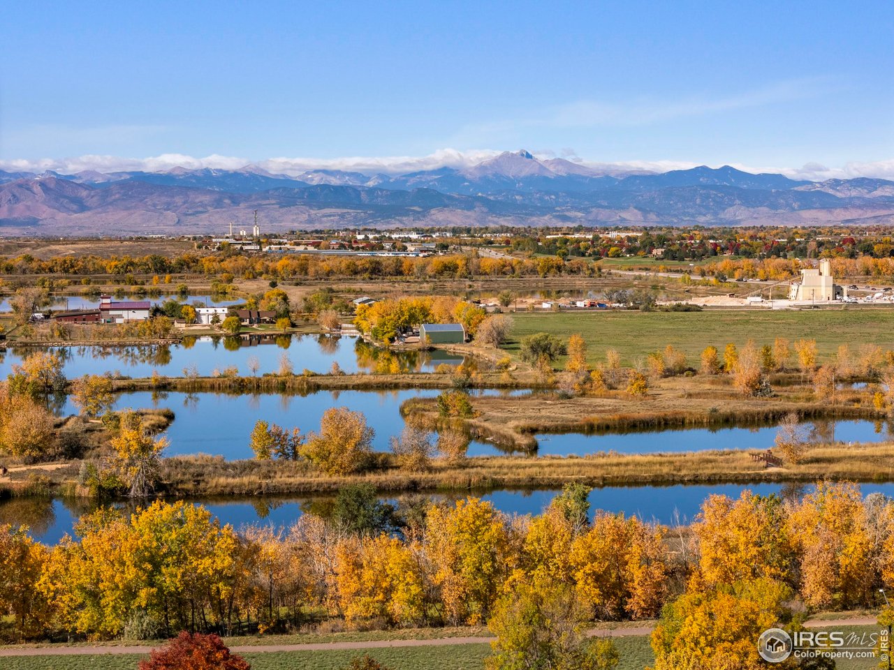 10688 Durango Place Longmont, CO 80504 - Photo 32 of 49 a view of a lake with a mountain