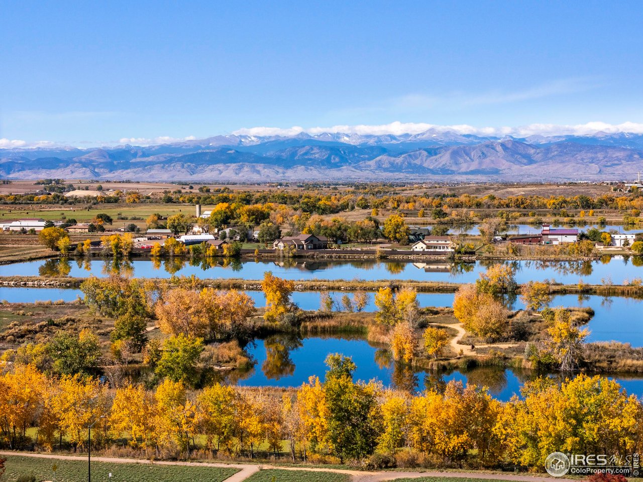 10688 Durango Place Longmont, CO 80504 - Photo 33 of 49 a view of a lake with a mountain