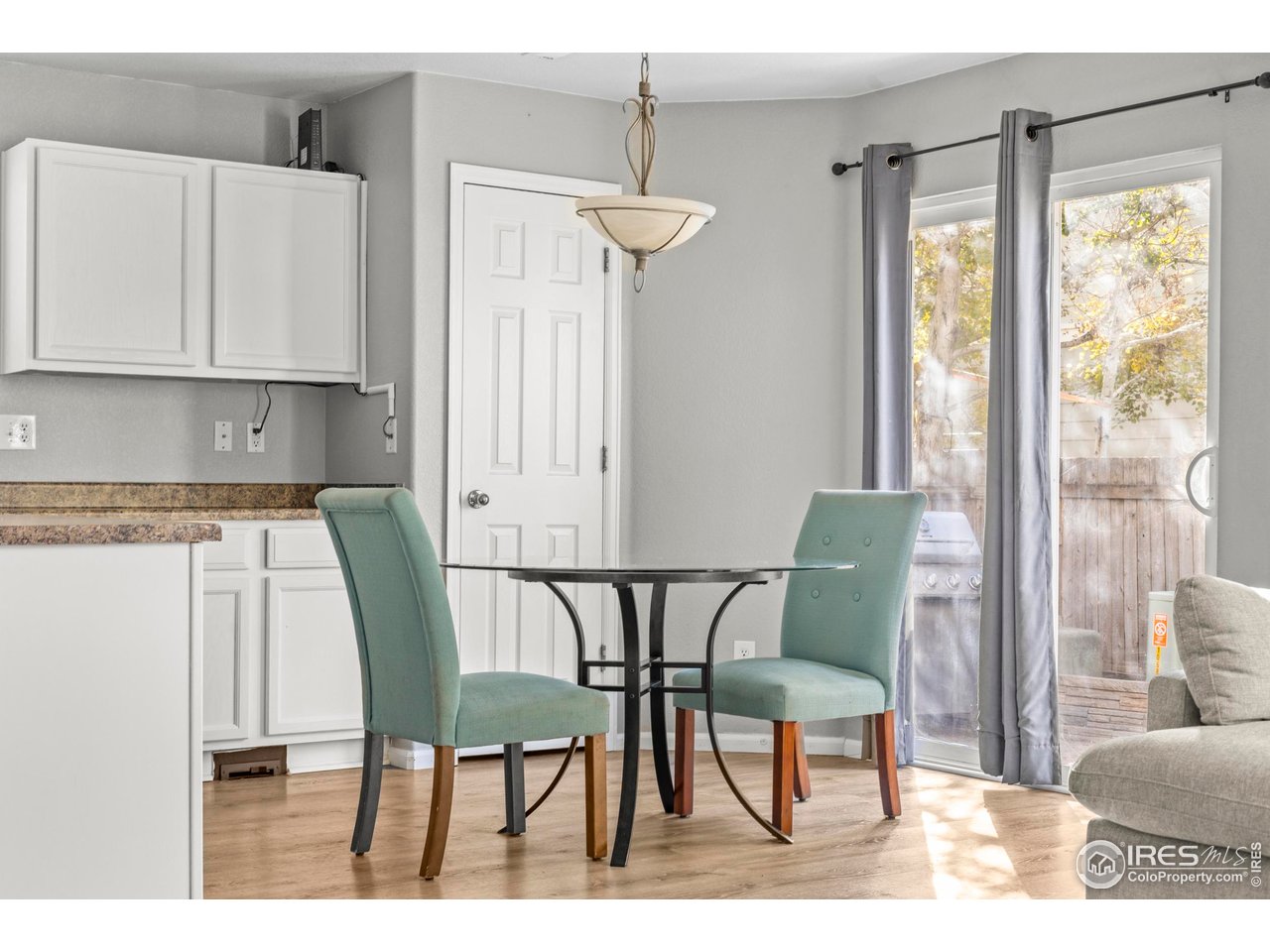 10688 Durango Place Longmont, CO 80504 - Photo 43 of 49 a view of a dining room with furniture and wooden floor
