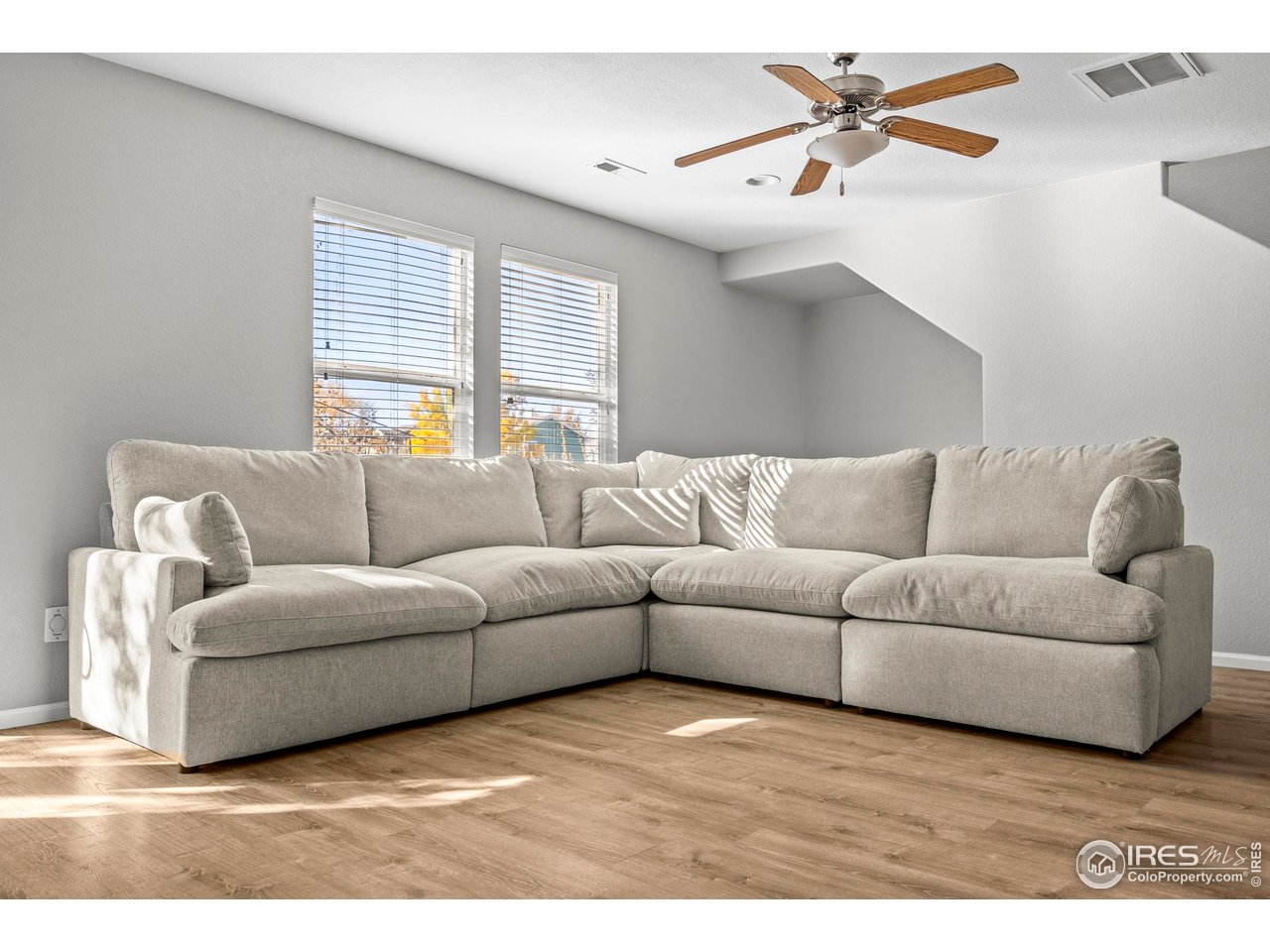10688 Durango Place Longmont, CO 80504 - Photo 46 of 49 a living room with furniture and a window