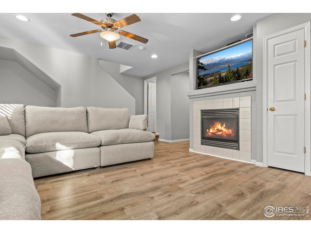 10688 Durango Place Longmont, CO 80504 - Photo 6 of 49 a living room with furniture and a fireplace