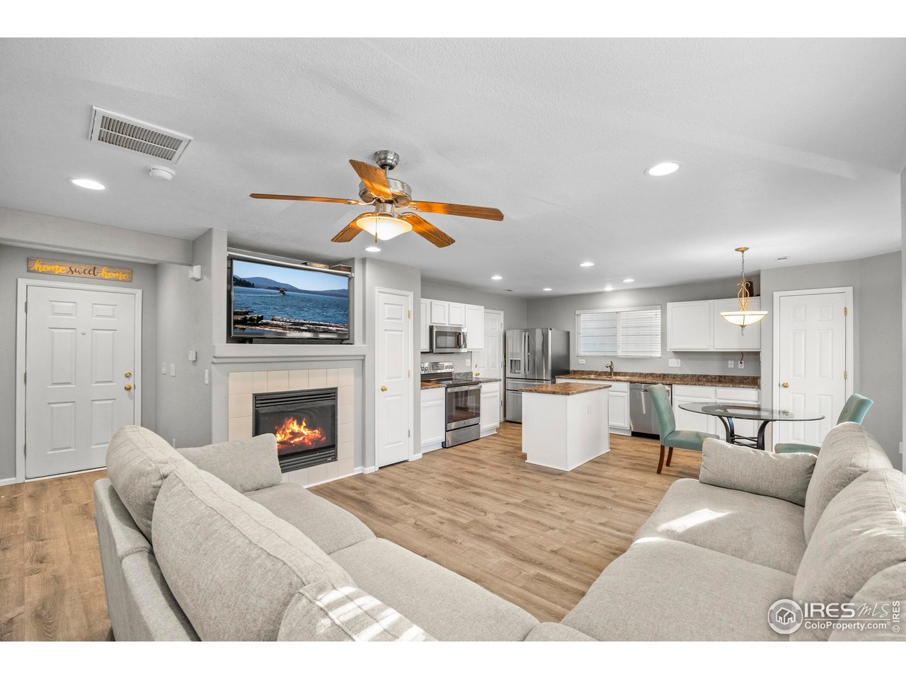 10688 Durango Place Longmont, CO 80504 - Photo 8 of 49 a living room with furniture and a fireplace