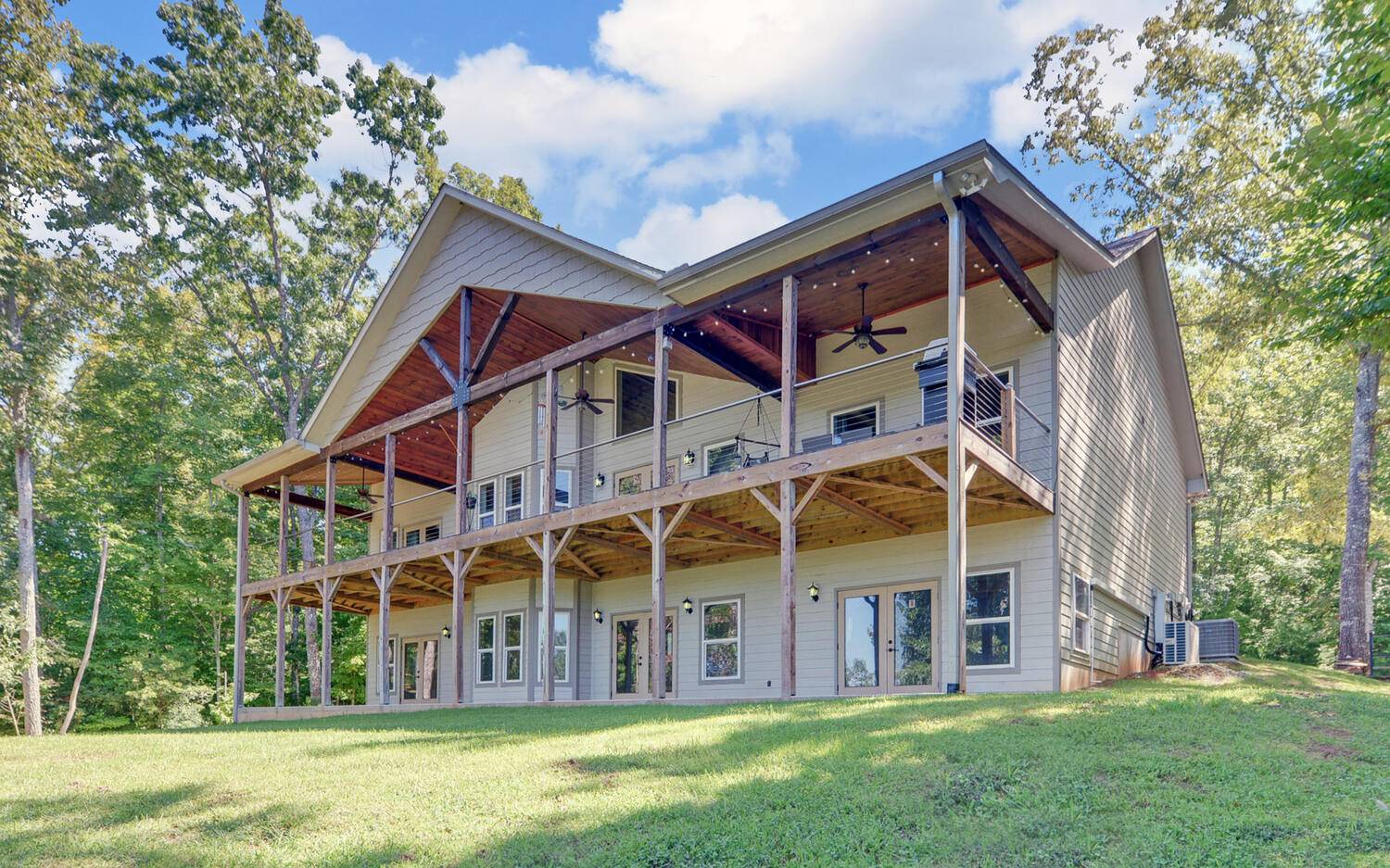 517 Wright Road Murphy, NC 28906 - Photo 1 of 44 a view of a big house with a big yard and large trees