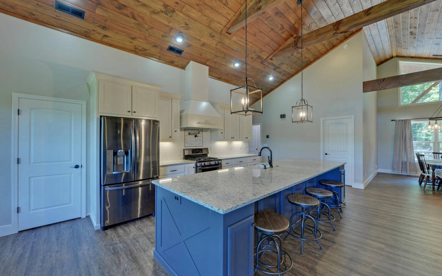 517 Wright Road Murphy, NC 28906 - Photo 3 of 44 a kitchen with stainless steel appliances a sink a stove a refrigerator cabinets and wooden floor