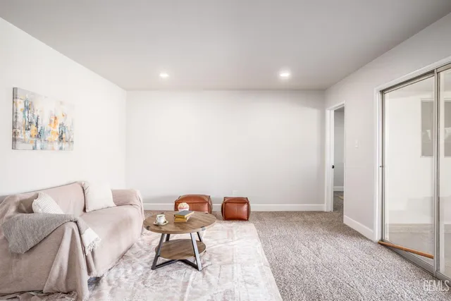 a room with furniture and a rug