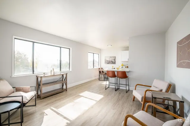 a living room with furniture or couch and a large window