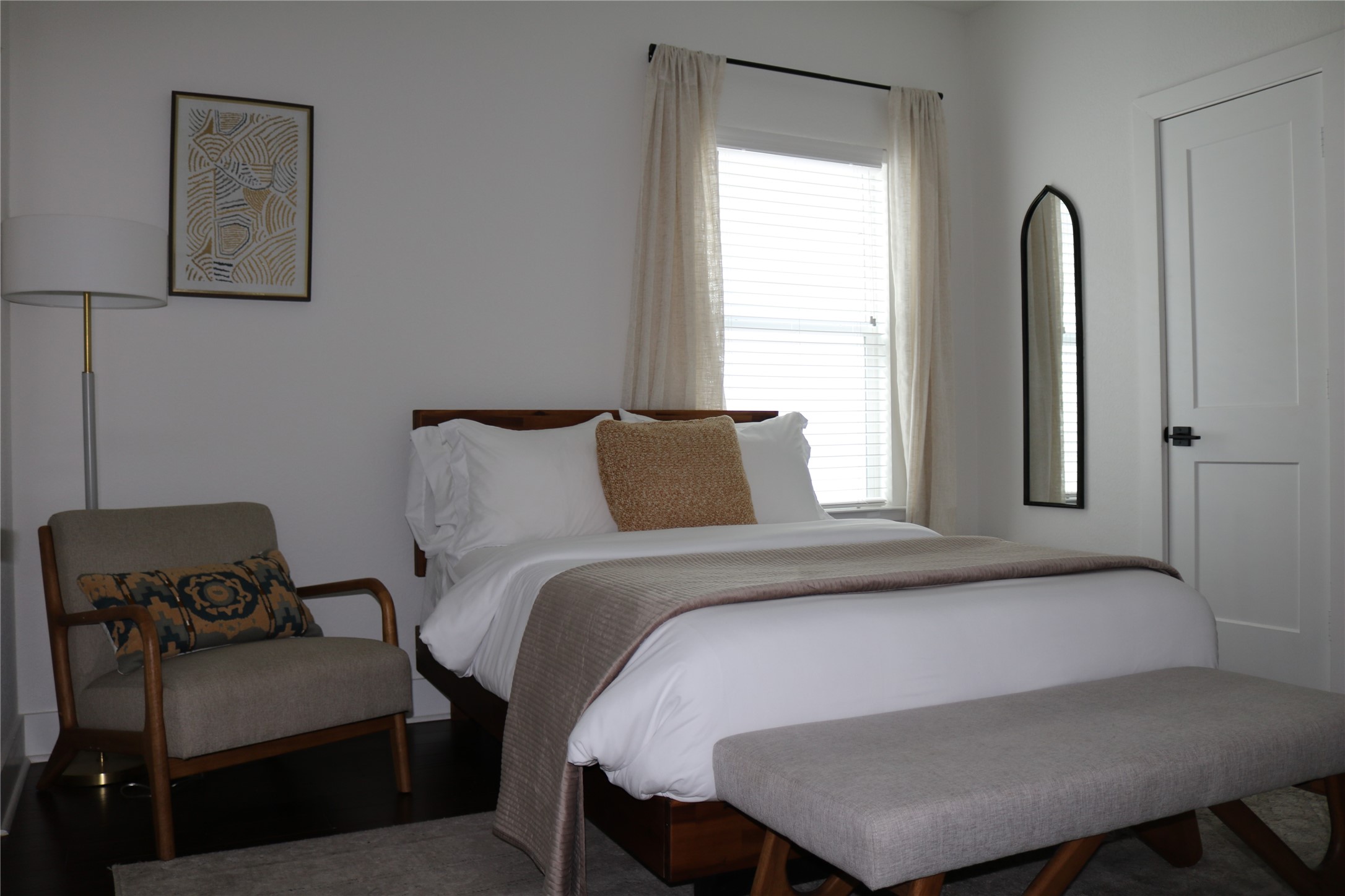 4714 Fisk Street Houston, TX 77009 - Photo 15 of 20 a bedroom with a bed and window