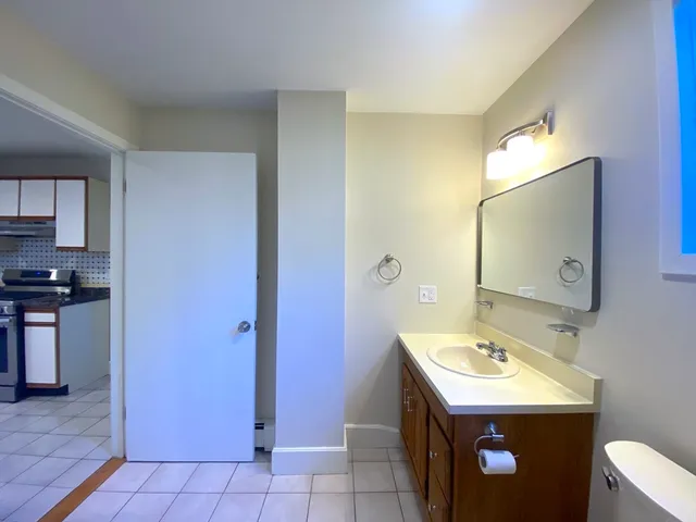 a utility room with cabinets washer and dryer
