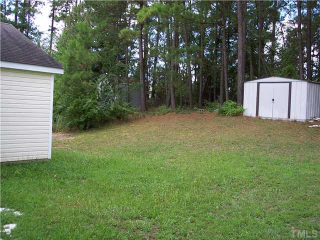 5519 Marthonna Way Raleigh, NC 27616 - Photo 2 of 10 a backyard of a house with lots of green space