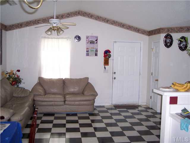 5519 Marthonna Way Raleigh, NC 27616 - Photo 4 of 10 a living room with furniture and a rug