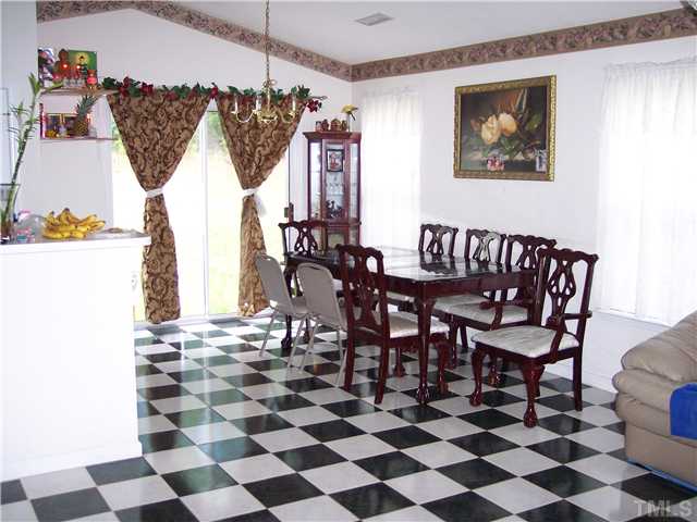 5519 Marthonna Way Raleigh, NC 27616 - Photo 5 of 10 a view of a dining room with furniture and chandelier