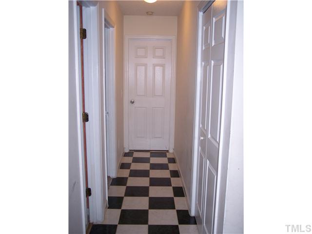 5519 Marthonna Way Raleigh, NC 27616 - Photo 8 of 10 a view of a bathroom with a black and white checkered floor