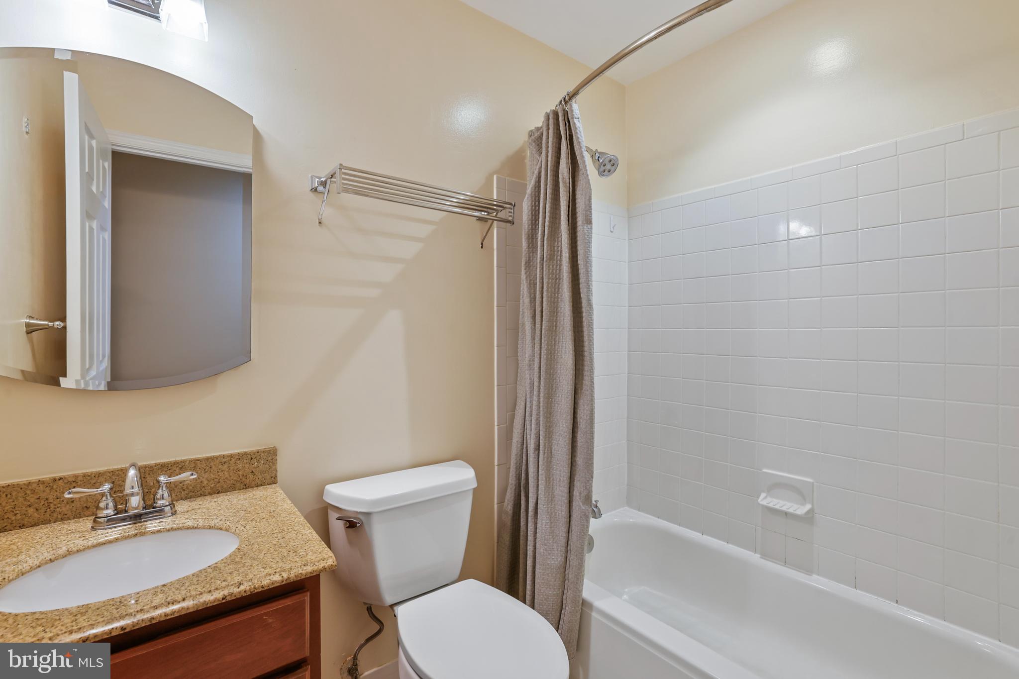 1117 O Street Northwest, Unit 2 Washington, DC 20005 - Photo 13 of 26 Bathroom with shower and tub, granite counter