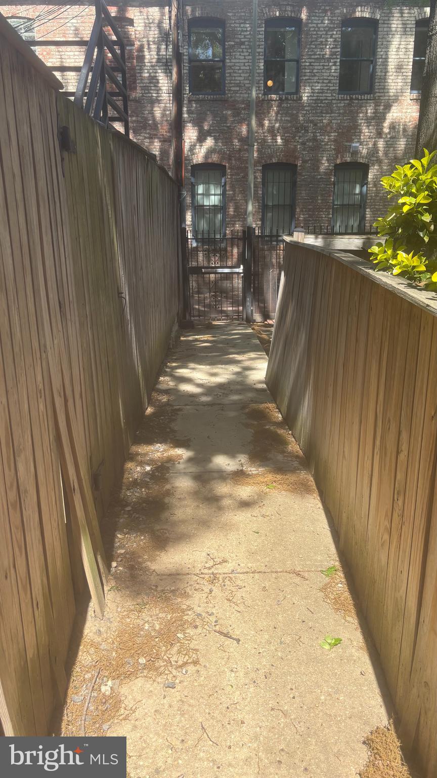 1117 O Street Northwest, Unit 2 Washington, DC 20005 - Photo 23 of 26 Secure alley access out from the unit.