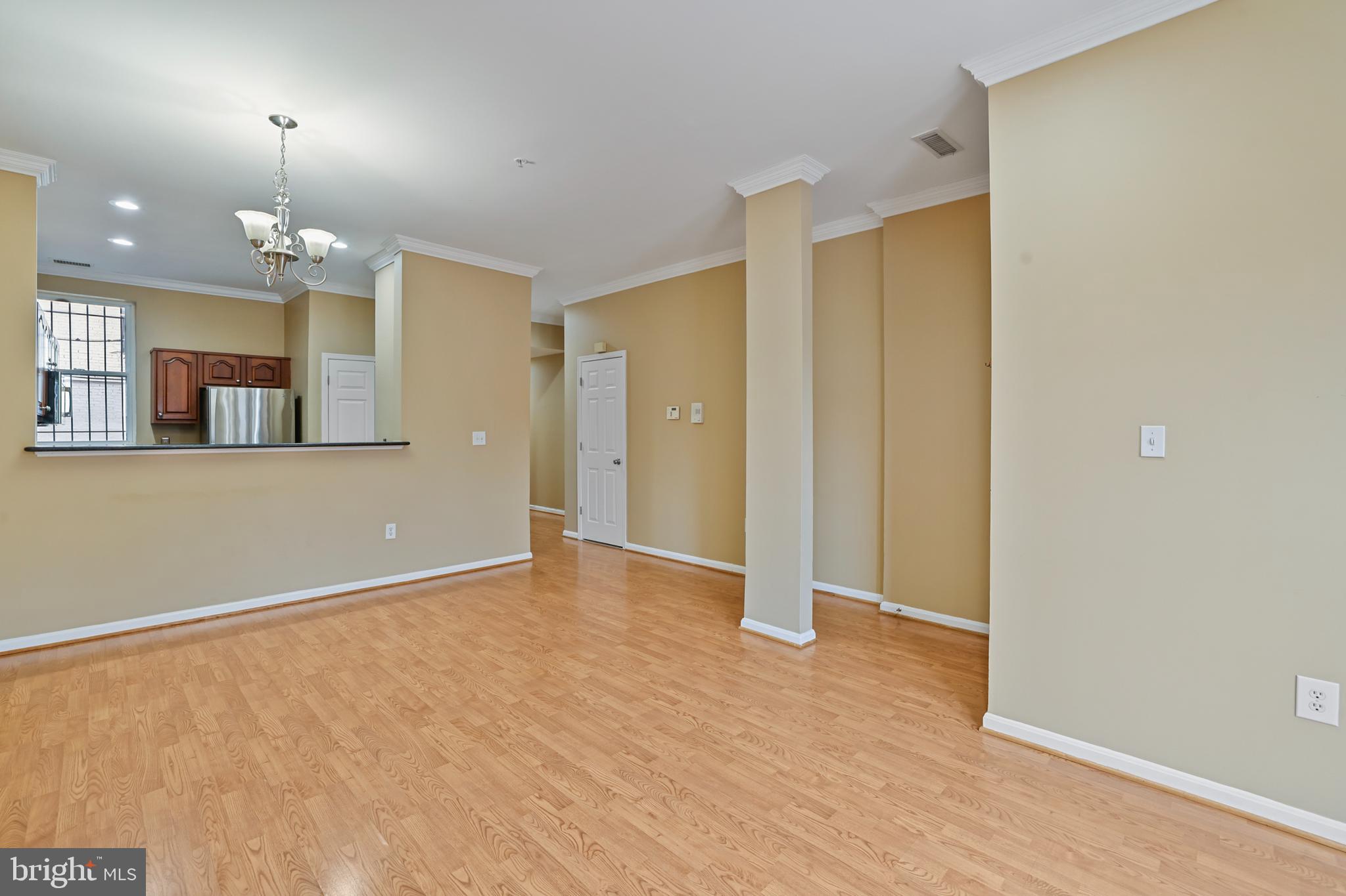 1117 O Street Northwest, Unit 2 Washington, DC 20005 - Photo 25 of 26 Galley kitchen beyond open floor plan