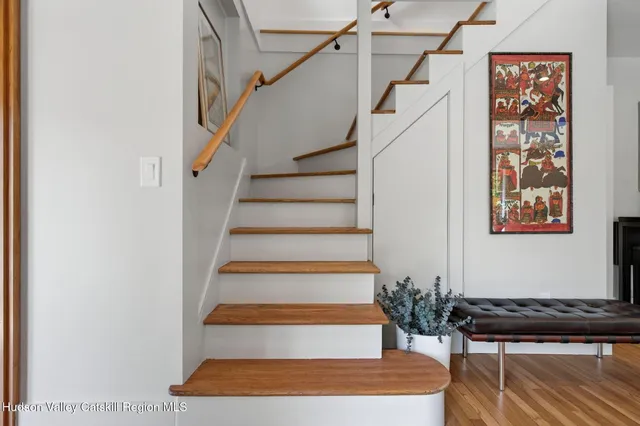a bathroom with a tub sink toilet and a mirror