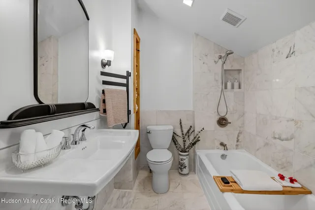 a view of a room with furniture and garden view