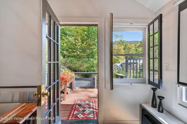 a view of a chair and table on the deck