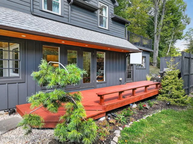 a front view of a house with an outdoor seating