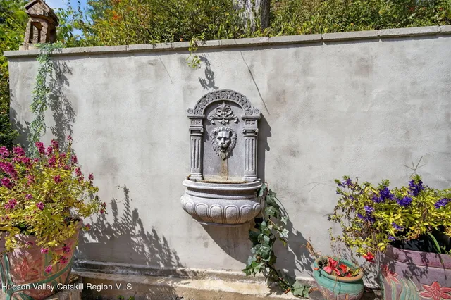 an aerial view of a house with swimming pool and garden