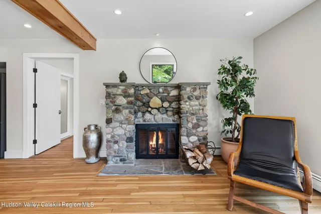 a kitchen with a table chairs refrigerator and cabinets