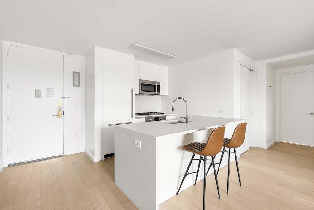 a view of a kitchen with a table and chairs