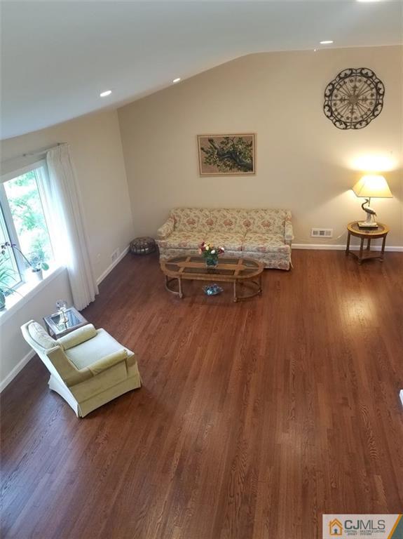 30 Agate Road East Brunswick, NJ 08816 - Photo 11 of 40 a living room with furniture and a wooden floor