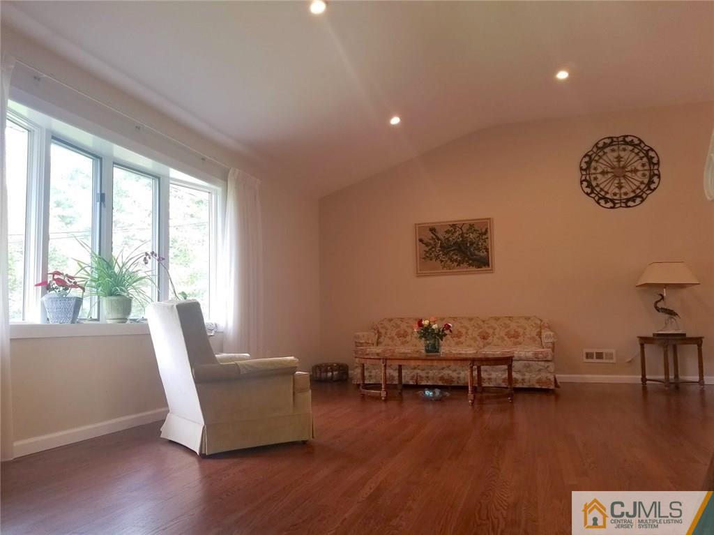 30 Agate Road East Brunswick, NJ 08816 - Photo 13 of 40 a living room with furniture and a wooden floor