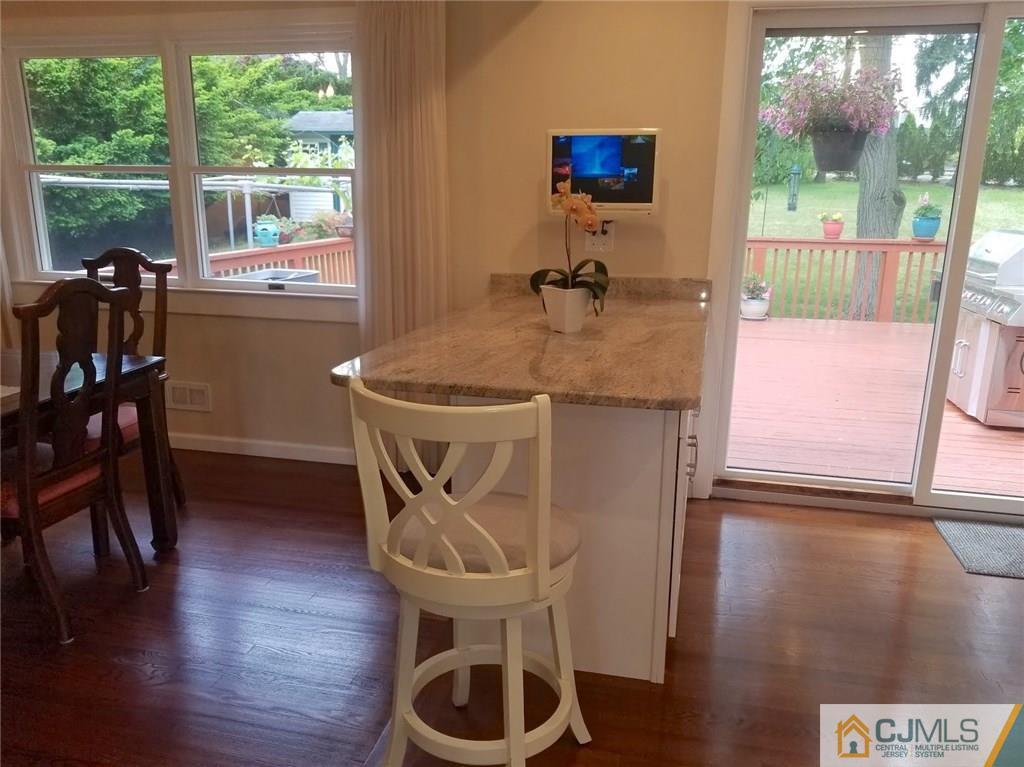 30 Agate Road East Brunswick, NJ 08816 - Photo 17 of 40 a dining room with furniture and wooden floor